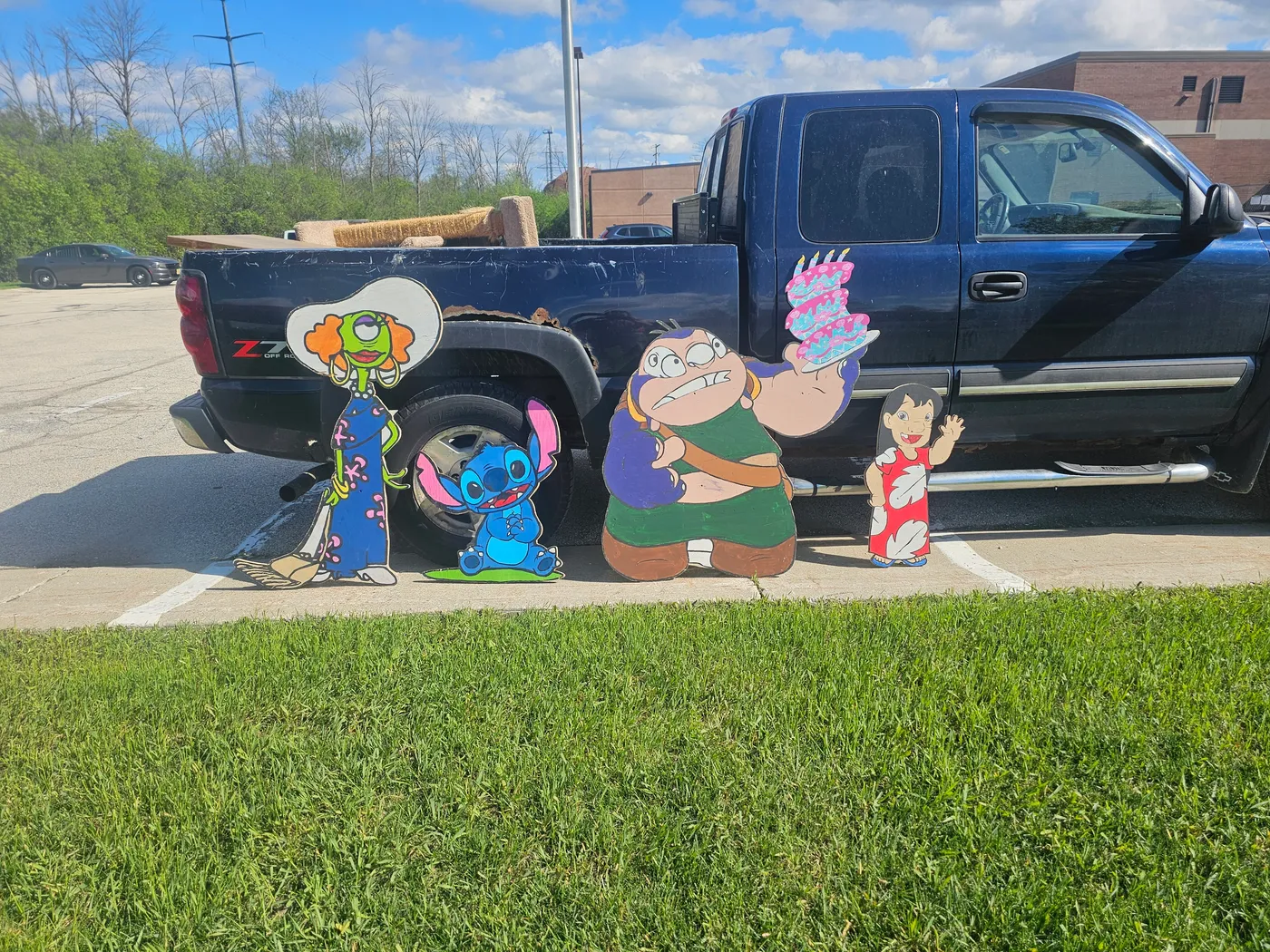 All character cutouts displayed in front of truck